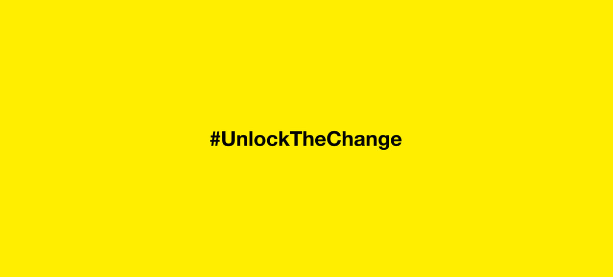 Bold black text "#UnlockTheChange" centered on a vibrant yellow background, conveying energy and transformation.
