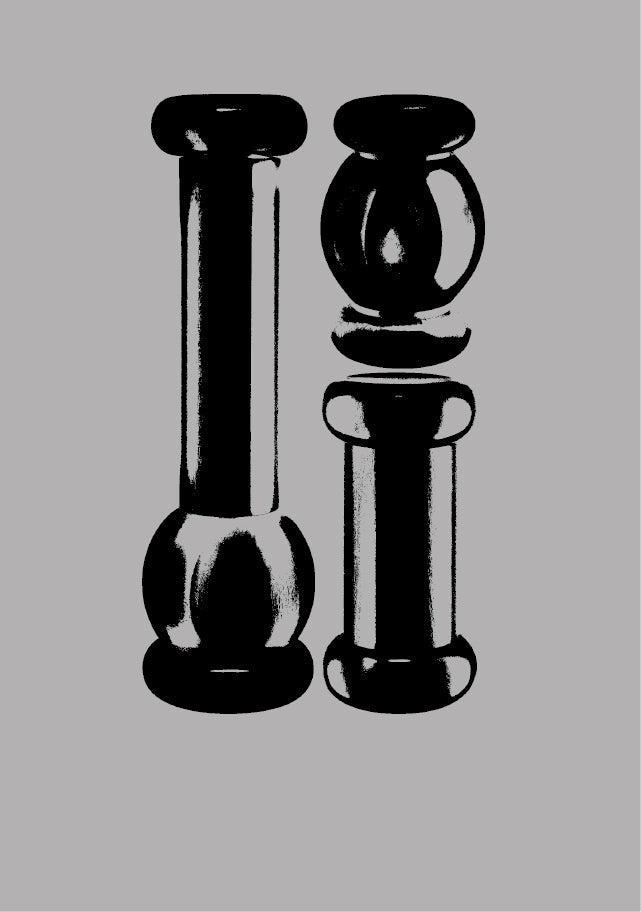 Two sleek black Alessi pepper mills with bold, sculptural forms stand against a neutral gray background, showcasing minimalist Italian design.