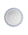 White ceramic salad serving bowl by Alessi, with a blue geometric diamond pattern around the rim, overhead view.