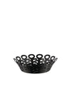 Black metal basket by Alessi with an open-work design of interconnected abstract shapes on a white background.