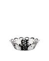Polished stainless steel basket by Alessi with an openwork pattern of stylized keyhole shapes.