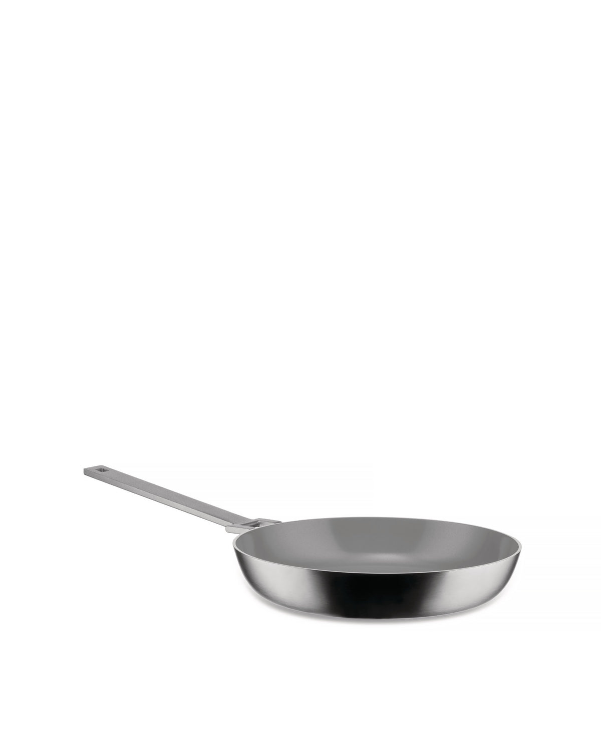 Silver frying pan by Alessi with a grey non-stick interior and long handle, angled view.