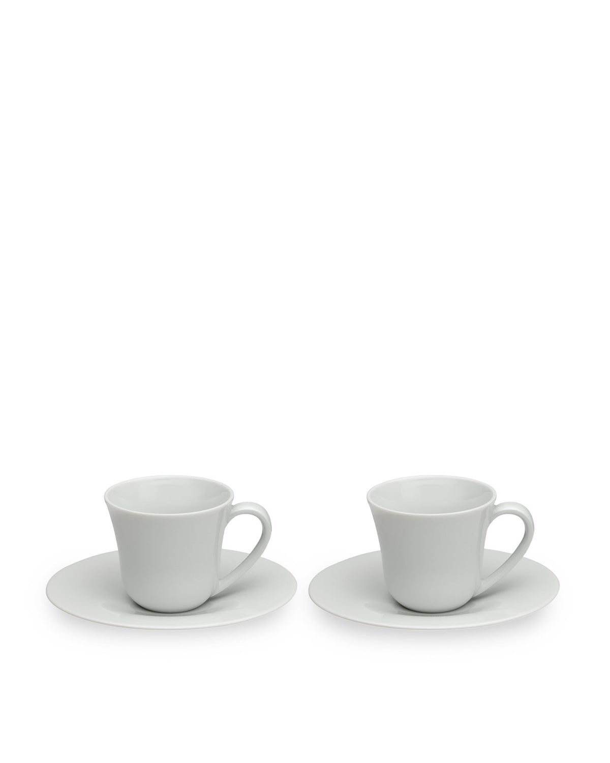 Two white ceramic cups with saucers by Alessi, featuring a simple, elegant curved design, presented at a slight angle.
