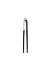 Black and silver kitchen tongs by Alessi with a chrome top and black handles.