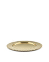 Golden metallic tray with a perforated edge by Alessi, angled on a white background.