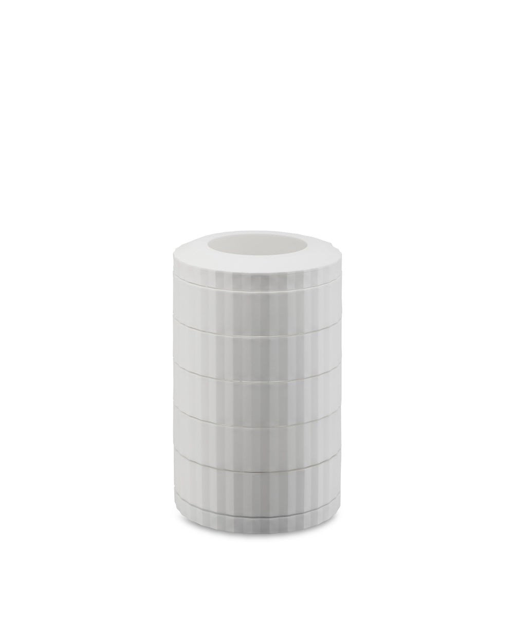 A white cylindrical capsule holder by Alessi, with stacked sections and vertical ribbed texture.