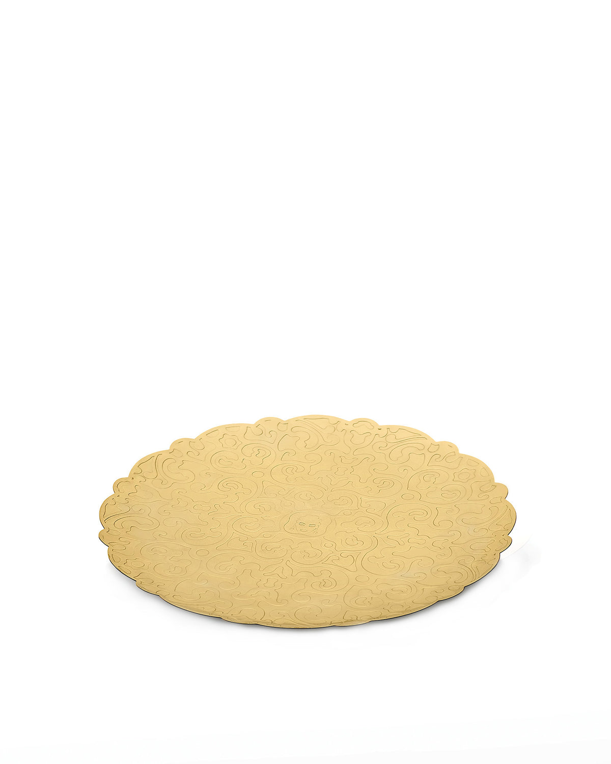 Gold metal tray by Alessi with a scalloped edge and embossed swirling pattern.