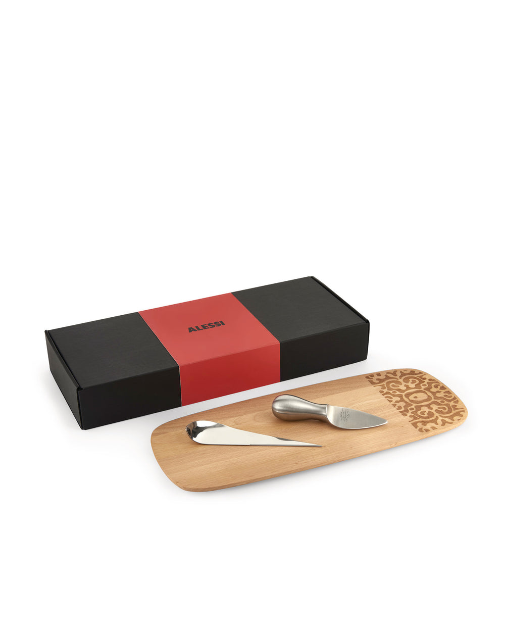 Cheese gift set by Alessi featuring a light wood board with an etched design, two steel cheese tools, and a black box with a red band.
