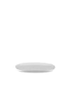 White oval Itsumo serving plate by Alessi, shown from an elevated angle on a white background.