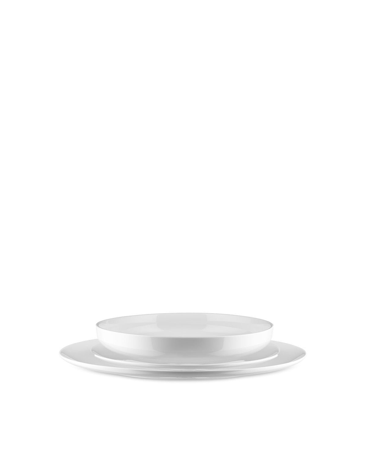 White table set by Alessi, featuring a dinner plate, salad plate, and deep bowl stacked together.