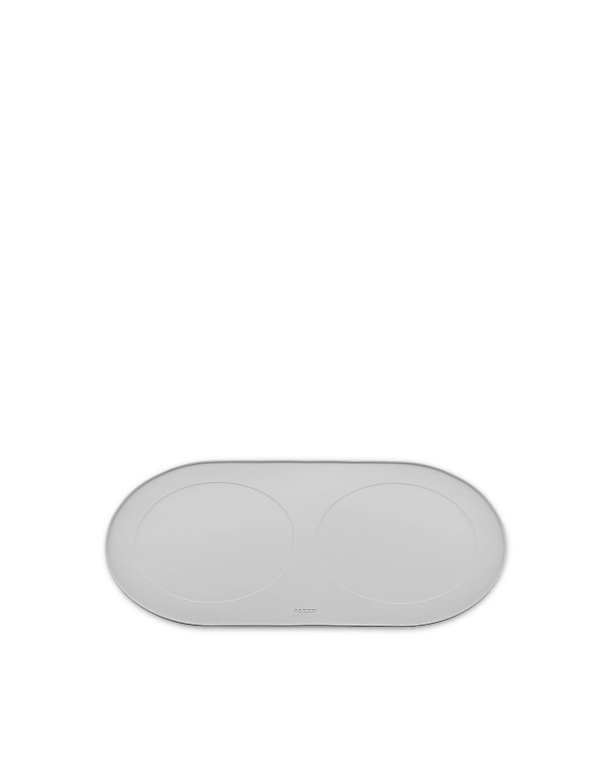 Grey oval pet feeding mat by Alessi with two circular indentations and embossed logo.