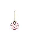 White and red Christmas tree ornament by Alessi with a red scallop pattern, hanging from a gold chain.