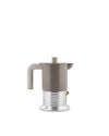 Taupe espresso coffee maker by Alessi with a ribbed metallic base and a small brass pressure valve, isolated on white.