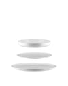 White ceramic table set by Alessi featuring a shallow bowl and two plates floating vertically.