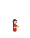 Red ornamental figurine by Alessi depicting a smiling girl with black hair holding a gold star.
