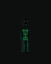 Black corkscrew with a glow-in-the-dark skeleton design by Alessi, styled as a smiling person wearing a hat.