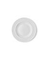 White ceramic side plate by Alessi with a simple design, viewed from above.