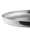 Silver metallic perforated tray by Alessi, with a dimpled surface and concentric dot patterns.