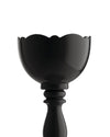 Glossy black egg cup by Alessi with a scalloped rim and a tall pedestal base against a white background.