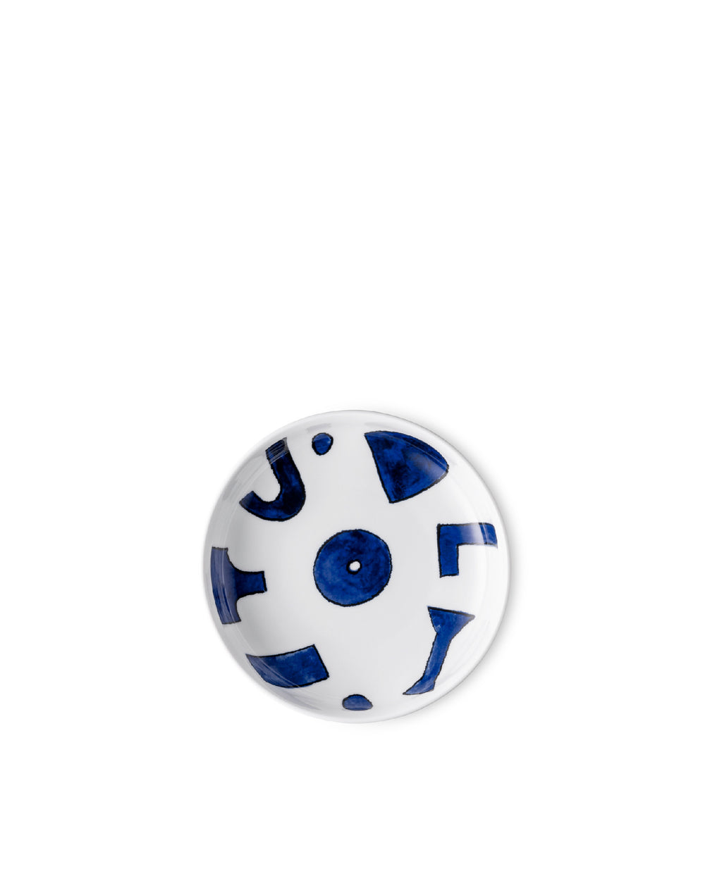 White ceramic round dish by Alessi, with abstract blue shapes and dots, on a white background.
