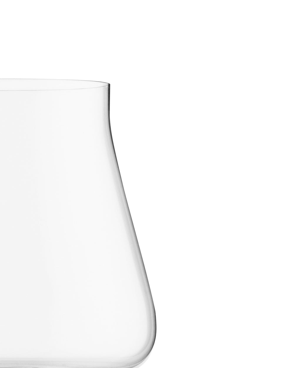 Elegant clear red wine glass by Alessi, with a curved shape, cropped.