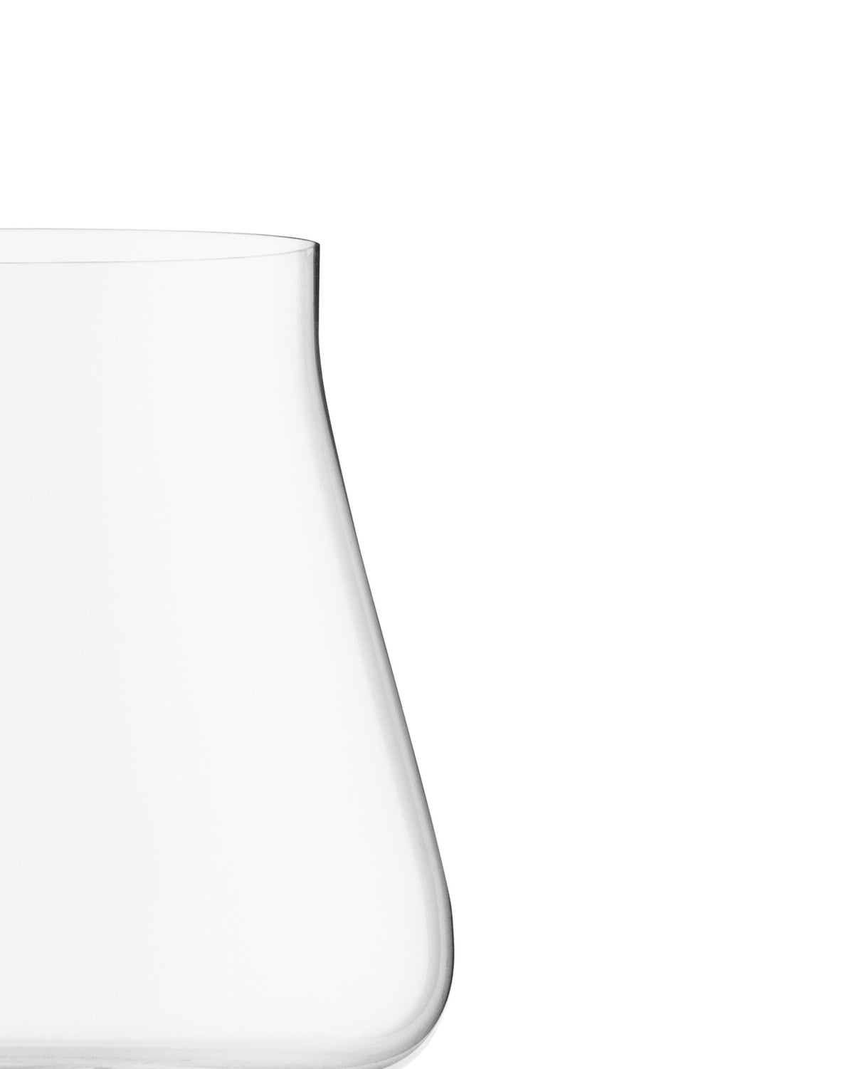Elegant clear red wine glass by Alessi, with a curved shape, cropped.