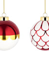 Two festive Christmas tree ornaments by Alessi: one metallic red and gold, one white with metallic red scallop patterns, both with gold caps.