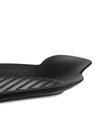 Black grill pan by Alessi, a close-up side view showing its dimpled grid pattern and curved handle.