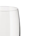 Clear glass champagne flute by Alessi with a curved rim, showing its transparent body cropped against white.