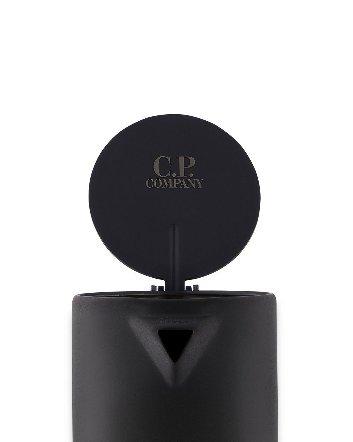 Black matte metal espresso coffee maker by Alessi with an open circular lid engraved with 'C.P. COMPANY', featuring 'ALESSI' subtly embossed near the spout.