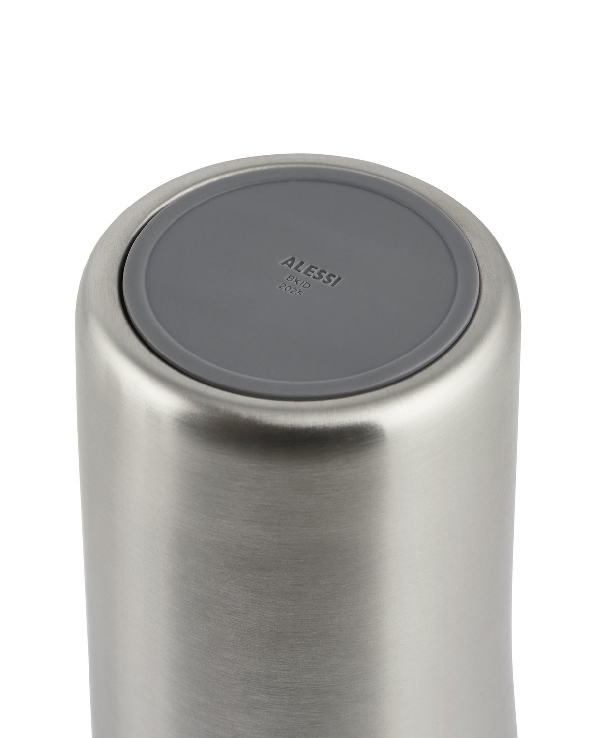 Brushed stainless steel thermo insulated tumbler by Alessi, with a gray cap embossed with 'ALESSI BKID 2025'.