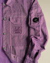 Purple crinkled jacket by Alessi, with C.P. Company chest embroidery and arm lens.
