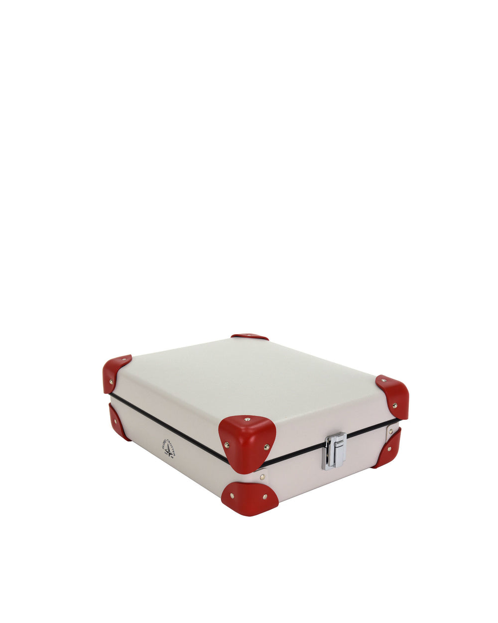 White cocktail shaker set by Alessi, an angled view of a rectangular case with red corners, black trim, silver clasp, and 'GLOBE TROTTER' logo.