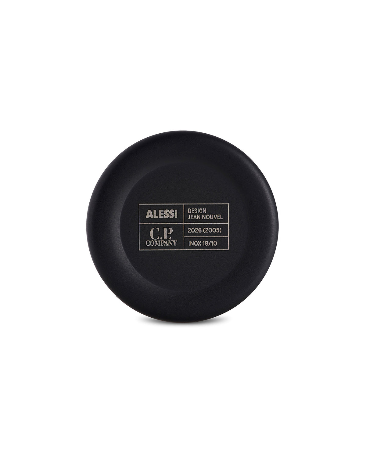 Black circular cup bottom by Alessi, engraved with brand, designer, and material details in a contrasting white grid.