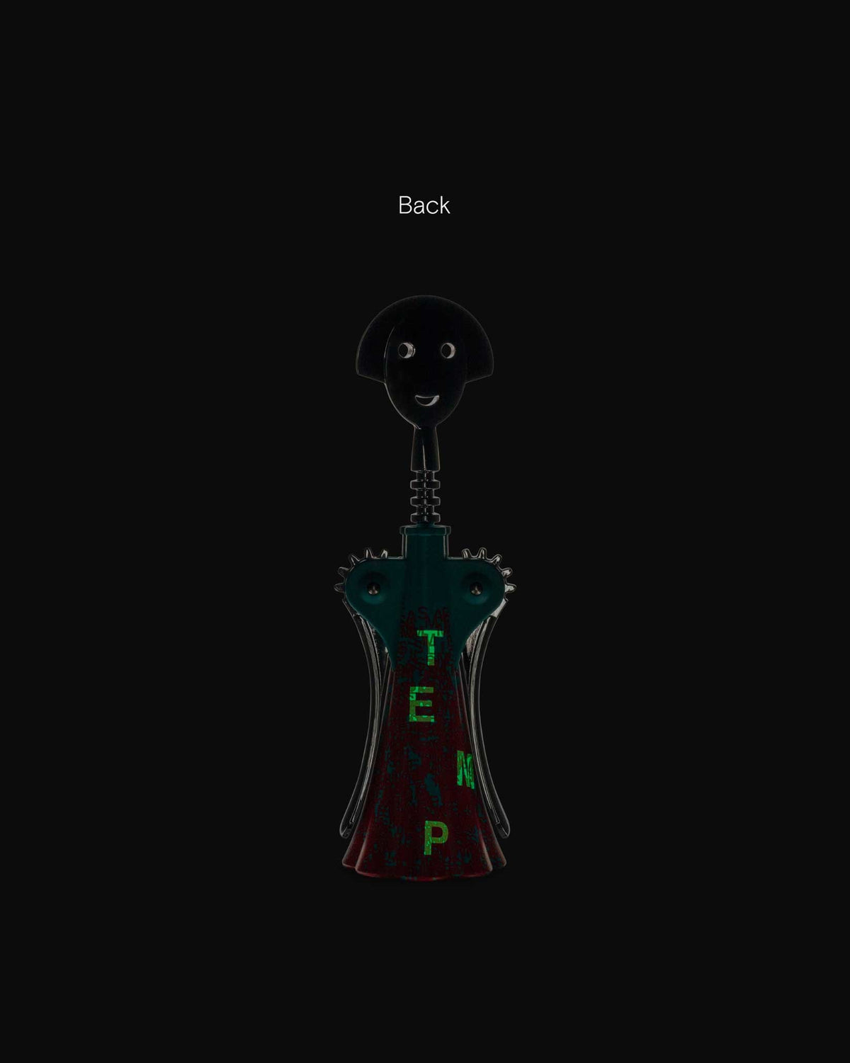 Anna G. corkscrew by Alessi, with a smiling black head, dark teal body, and green 'TEMP' text on a reddish base, back view.