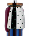 Figural corkscrew by Alessi, with a metallic silver and black upper body featuring green holes, a maroon arm, copper top, and striped blue base.