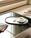 Silver oval Pleats tray by Alessi, featuring a decorative scalloped edge.