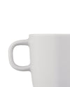 White cup by Alessi, cropped, showing a simple handle against a white background.