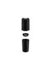 Black plastic capsule crusher by Alessi disassembled into three ribbed pieces.