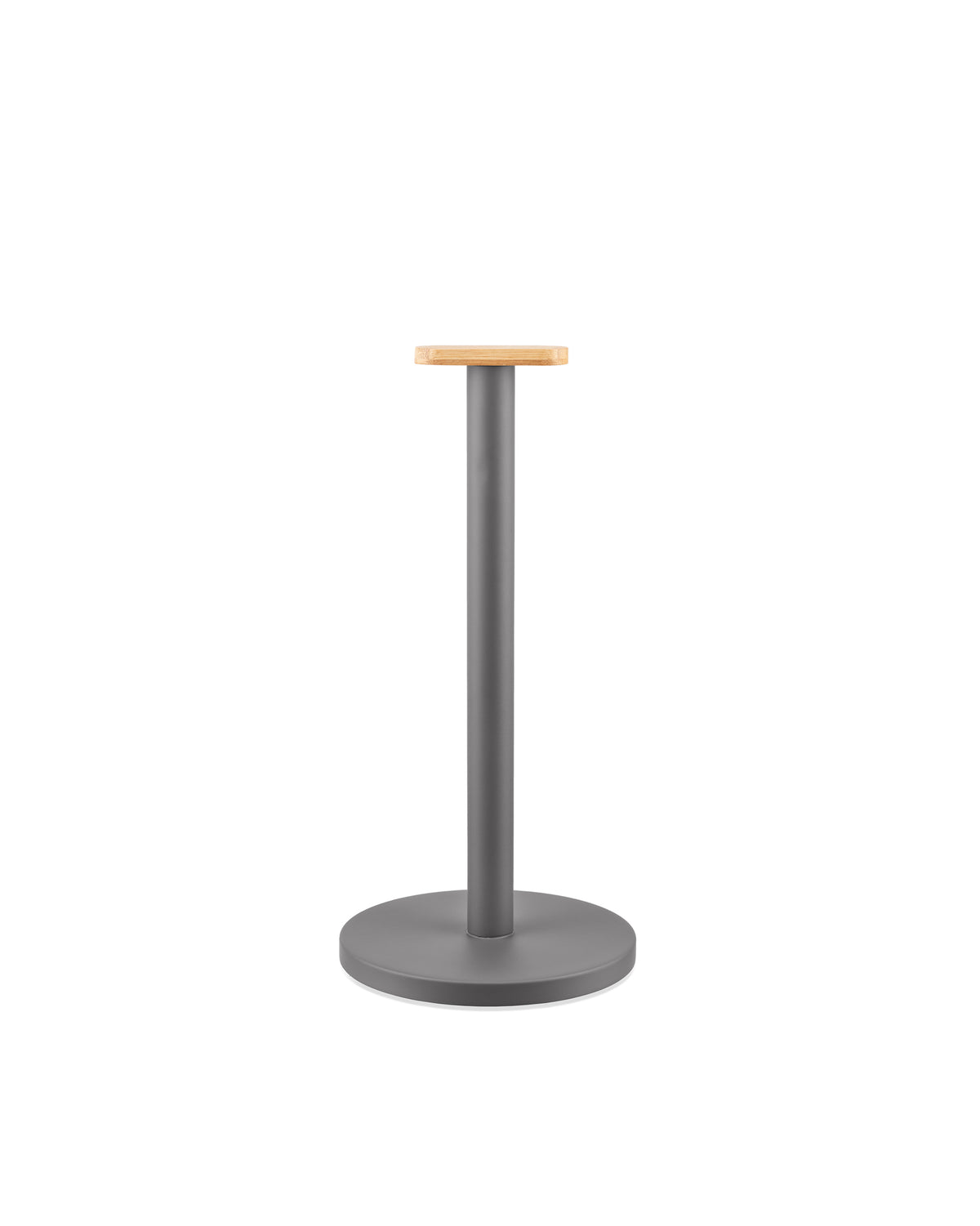 Grey metal paper towel holder by Alessi, with a light wood rectangular top and circular base.