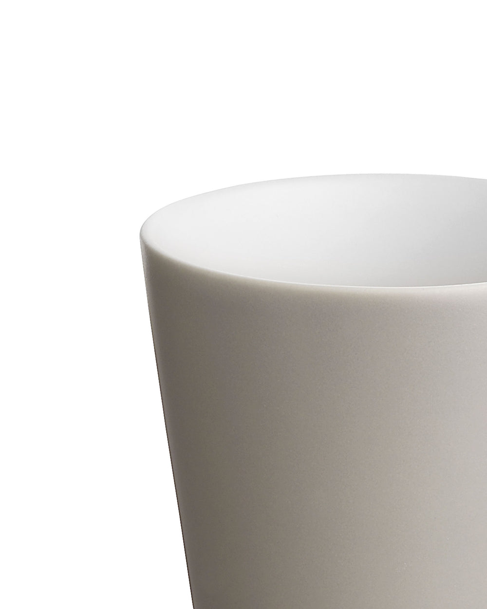Light gray ceramic cup by Alessi with a smooth matte finish and white interior, cropped.