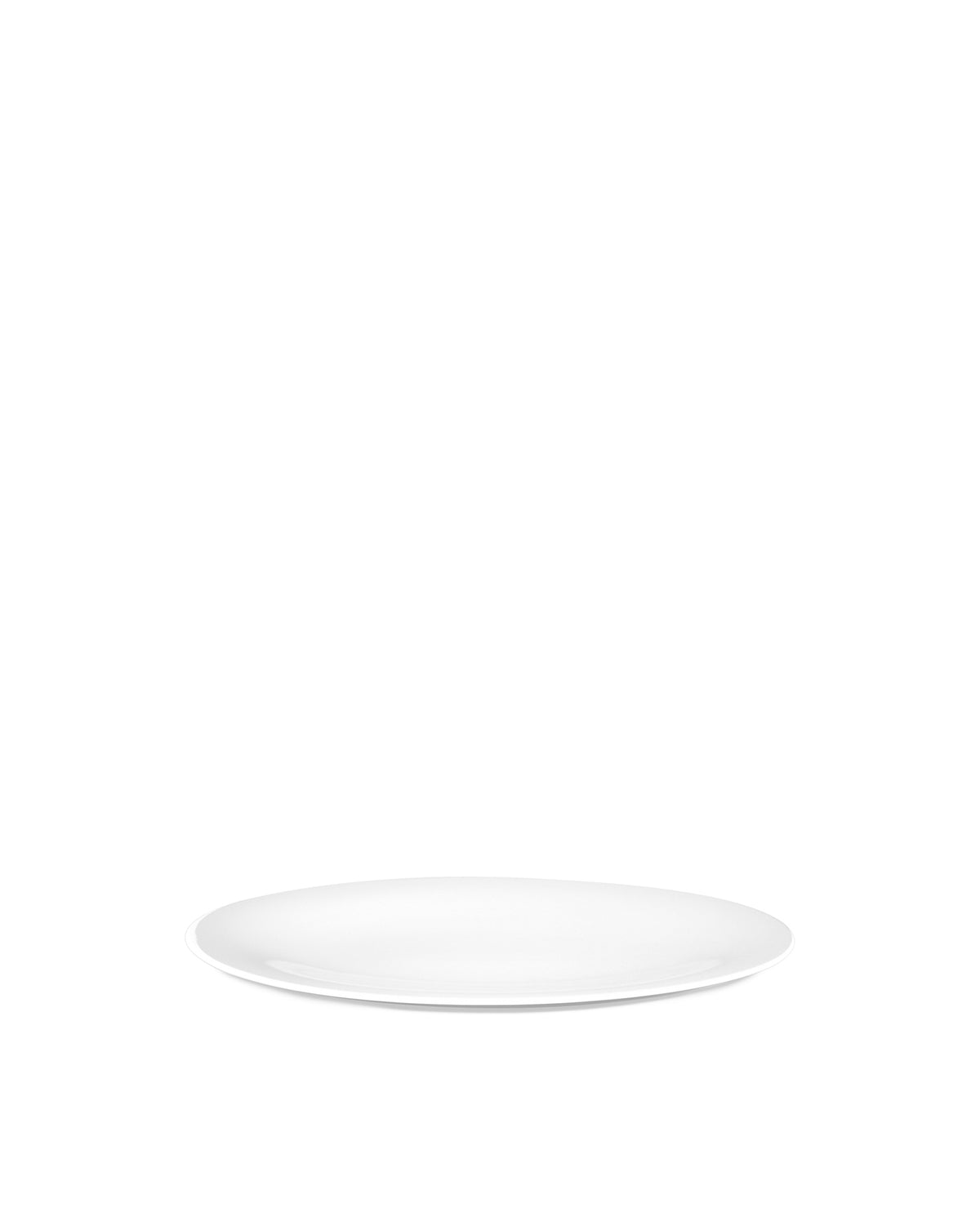 White serving plate by Alessi, oval and glossy, shown at an angle casting a soft shadow.