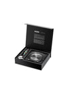 Wine mixology set in an open black presentation box by Alessi, with a colorful polka-dot corkscrew, silver pourer, and a spiral-patterned coaster.