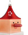 Red and peach cube-shaped Cubocchio Christmas tree ornament by Alessi with a conical hat, white flower, black eyes, long red nose, and red mouth.