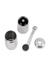 Stainless steel coffee grinder by Alessi, disassembled into four polished components on a white background.