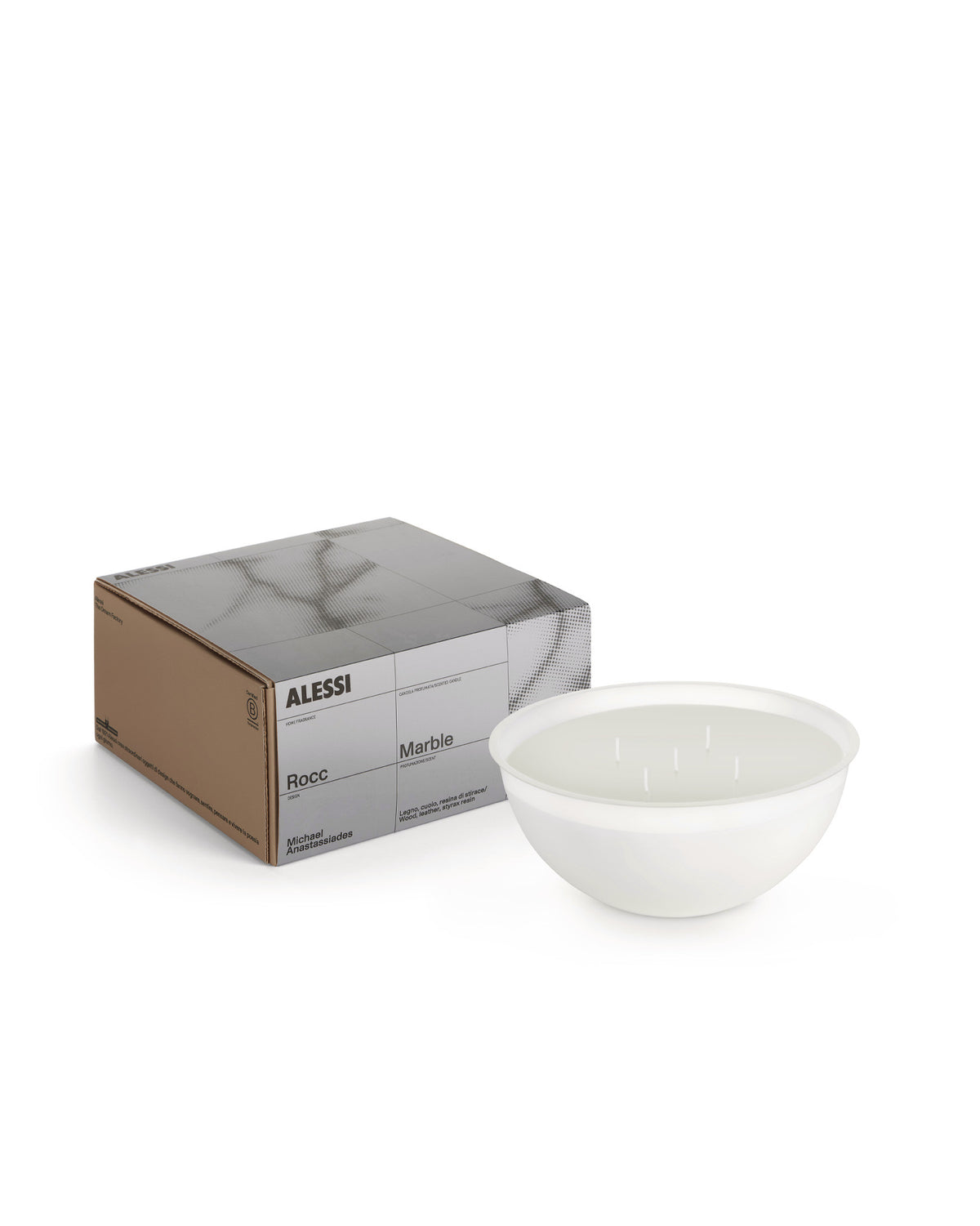 White multi-wick Rocc candle by Alessi, in a bowl next to its brown box with a grey marble pattern.