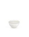 White three-wick candle by Alessi in a minimalist round bowl, presented at a slight angle.