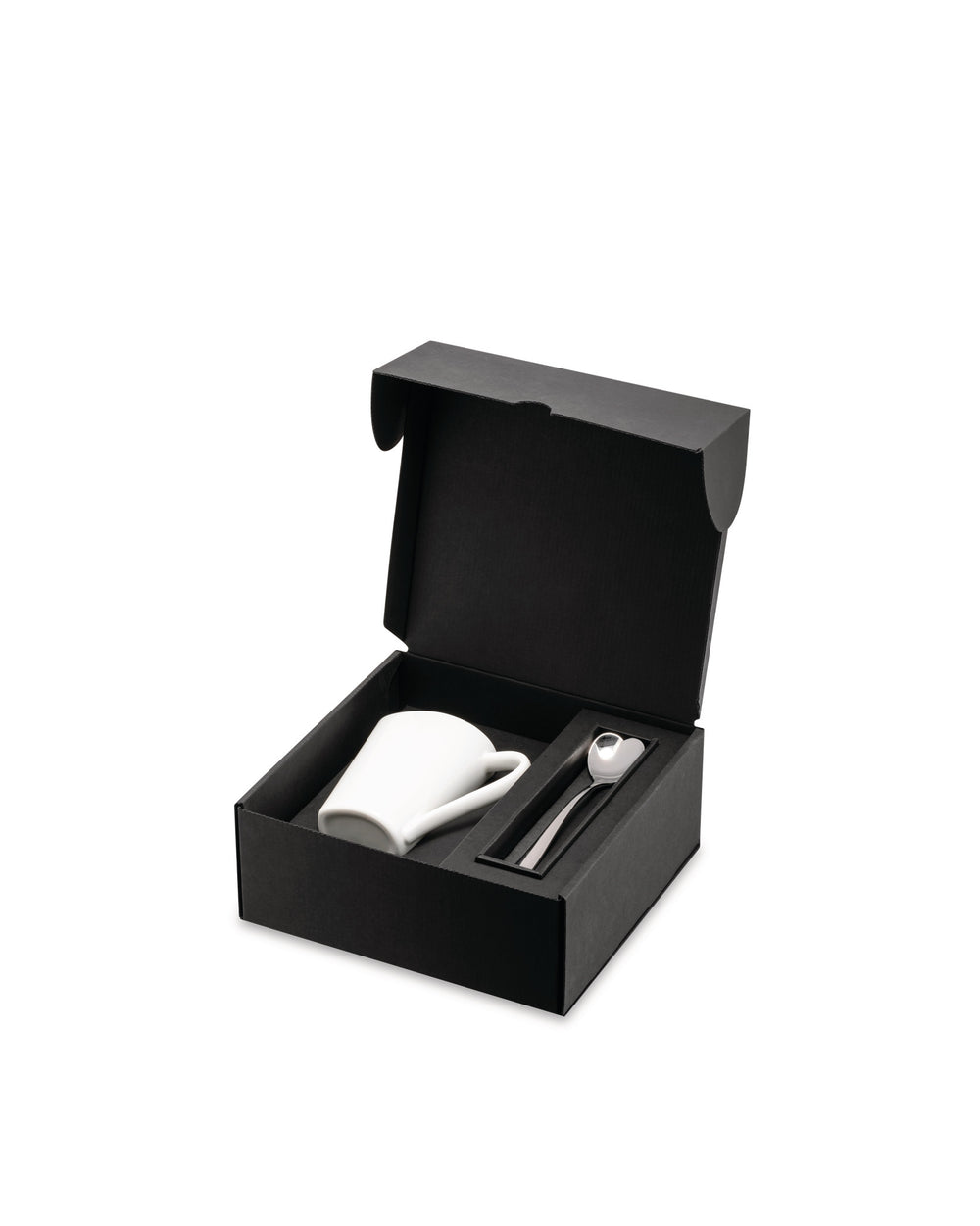 White mug and spoon gift set by Alessi in an open black presentation box with a heart-shaped spoon.