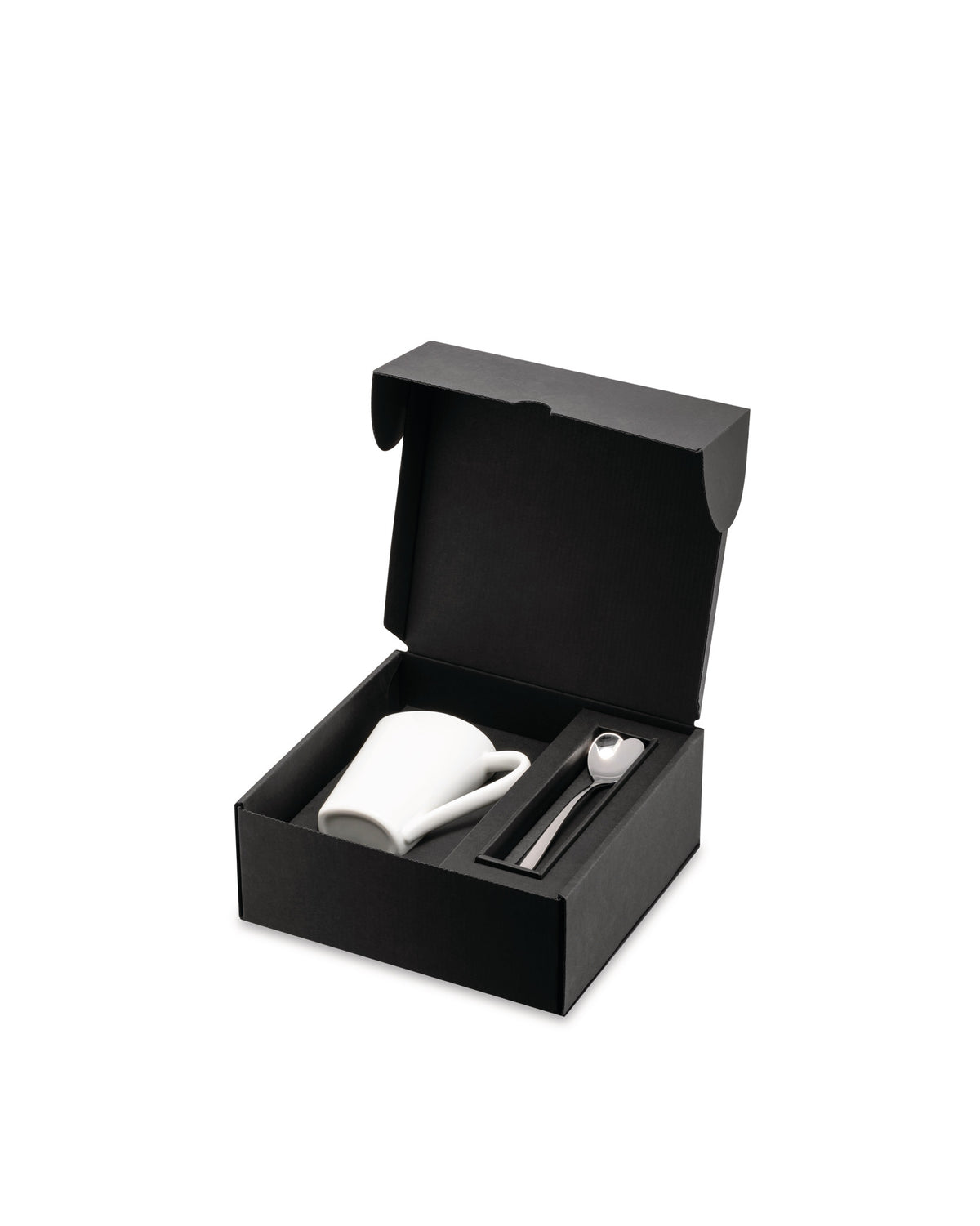 White mug and spoon gift set by Alessi in an open black presentation box with a heart-shaped spoon.