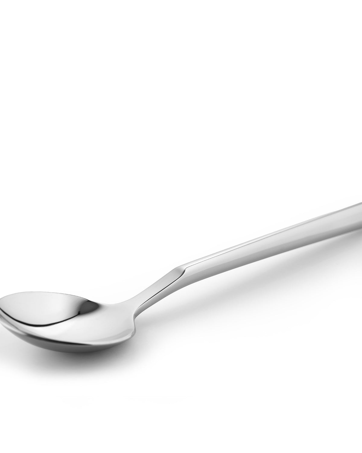Modern silver Clivo spoon by Alessi with a distinct angular handle, angled on a bright white surface.